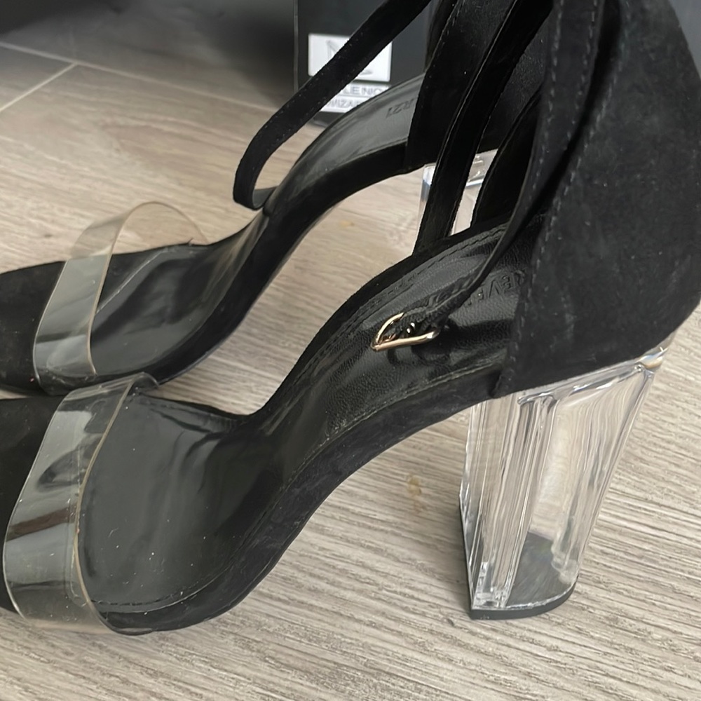 Black heels and clear bottoms